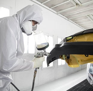Collision Center Technician Painting a Vehicle | Toyota of Cool Springs in Franklin TN